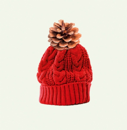 Red bobble hat or knit hat isolated against a white background.